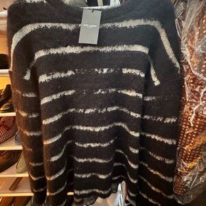 Yves Saint Laurent Black and White Striped Sweater
$1350 MSRP